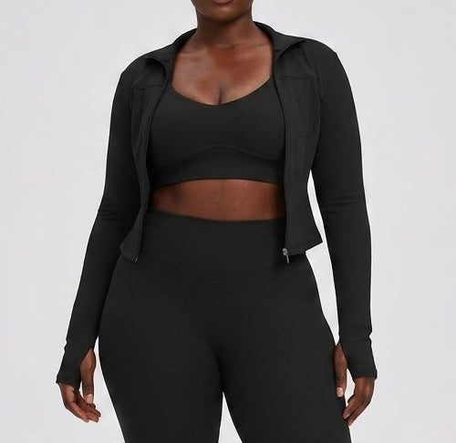 Person wearing a black athletic outfit on a white background